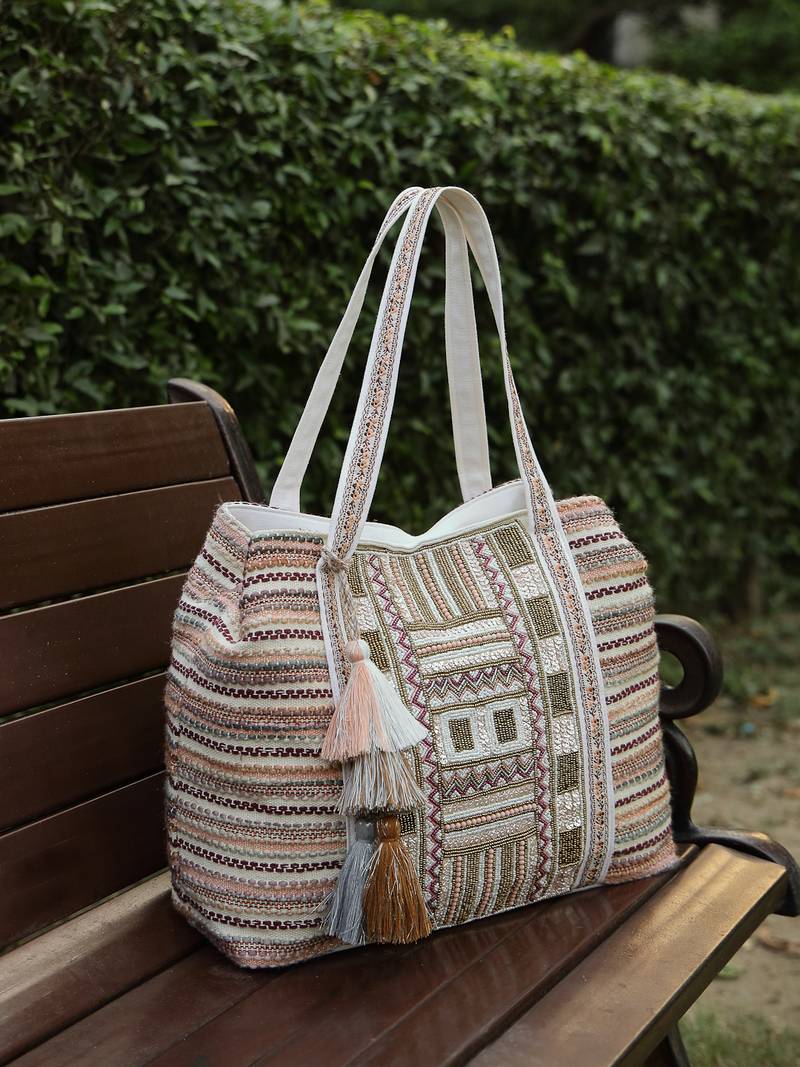   folklore edit blush pink tribal geometric jacquard hobo bag
