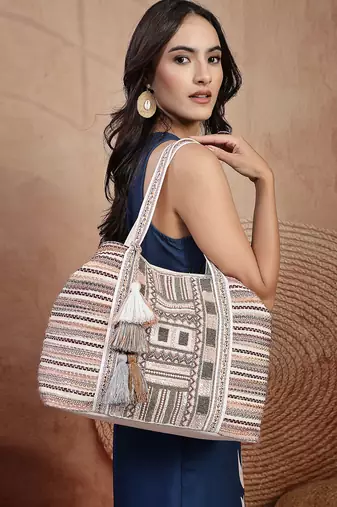   folklore edit blush pink tribal geometric jacquard hobo bag