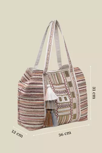   folklore edit blush pink tribal geometric jacquard hobo bag