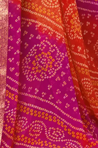 Women's orange pink bandhani print chiffon bandhej style saree with matching blouse