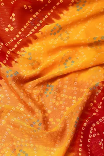 Women's yellow bandhani print chiffon bandhej style saree with matching blouse