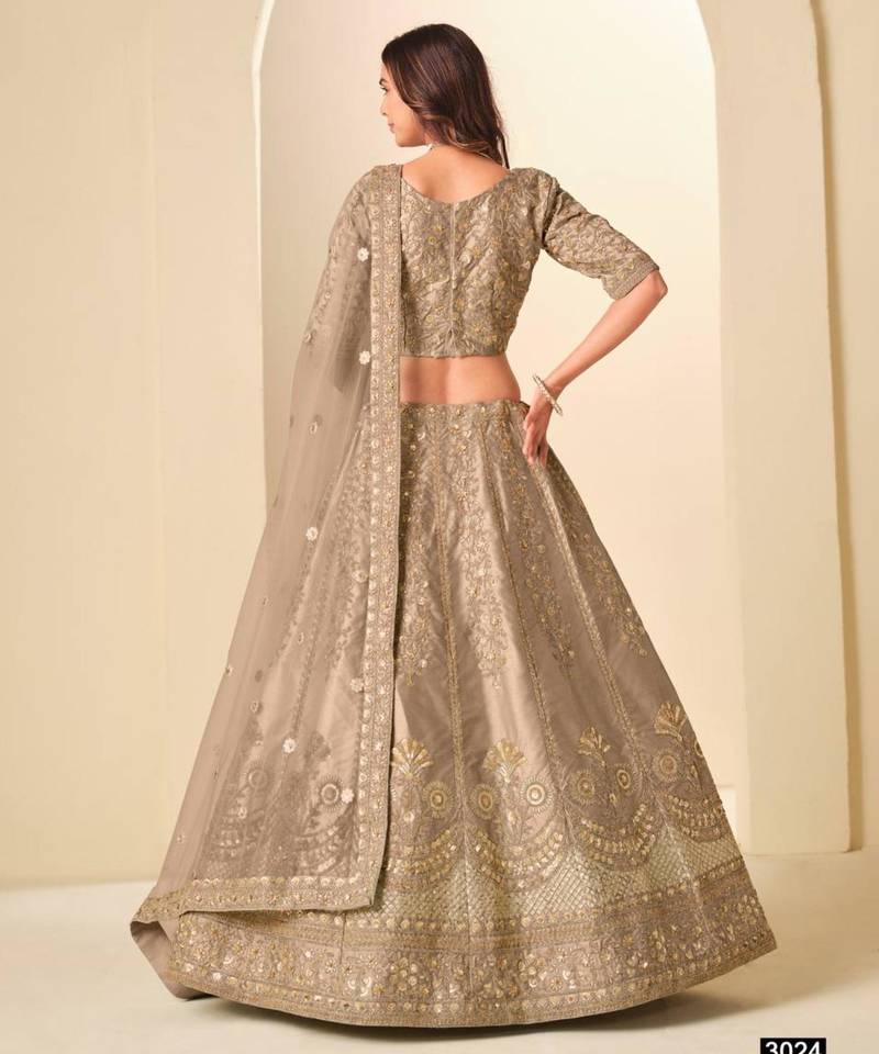 dark-beige art_silk embroidered lehengas