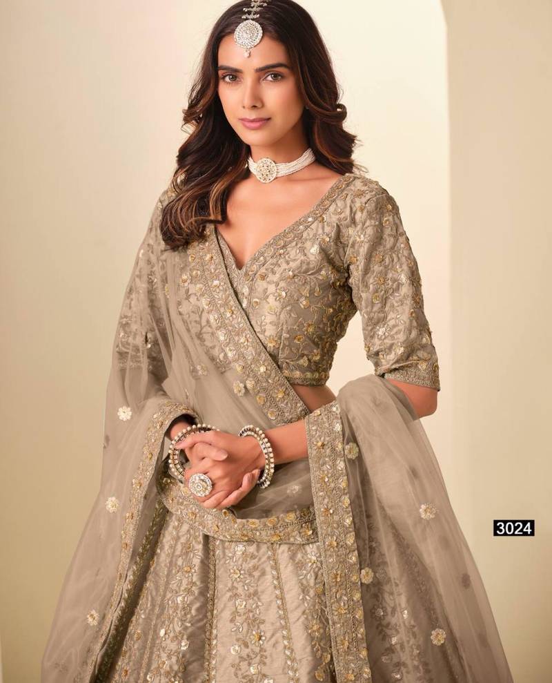dark-beige art_silk embroidered lehengas