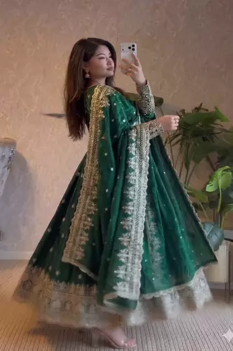 Dark green heavy flared wedding wear anarkali salwar kameez