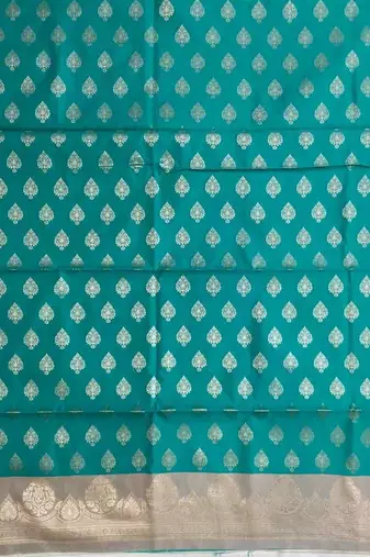 Banarasi semi silk 3pcs unstiched dress material in turquoise colour with zari booti work