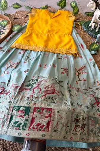 Girls yellow embroidered peplum top with position printed lehengha set
