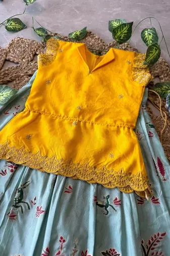 Girls yellow embroidered peplum top with position printed lehengha set