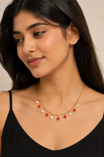 Gold-toned chain necklace with coral and pearl charm dangles, women's fashion jewellery