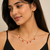Gold-toned chain necklace with coral and pearl charm dangles, women's fashion jewellery