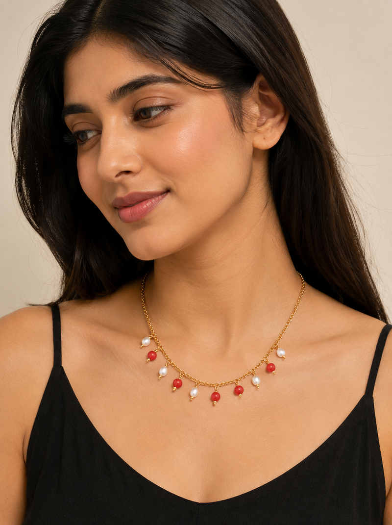 Gold-toned chain necklace with coral and pearl charm dangles, women's fashion jewellery