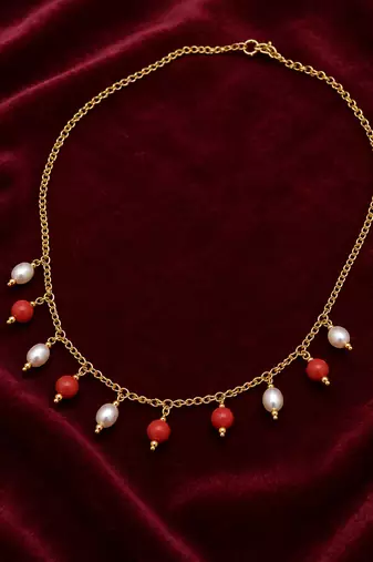 Gold-toned chain necklace with coral and pearl charm dangles, women's fashion jewellery