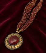 Multi-strand beaded pendant necklace, red and gold, round cabochon pendant, boho ethnic style