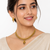 Gold-toned floral necklace and earrings set with pearl drops, traditional indian jewellery