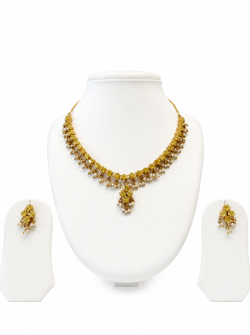 Gold-toned floral necklace and earrings set with pearl drops, traditional indian jewellery