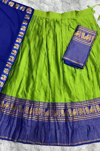 Green kanjivaram silk blend half saree with traditional gold zari weaving work