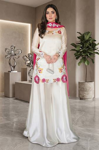 Elegant ivory silk sharara suit set with vibrant floral embroidery