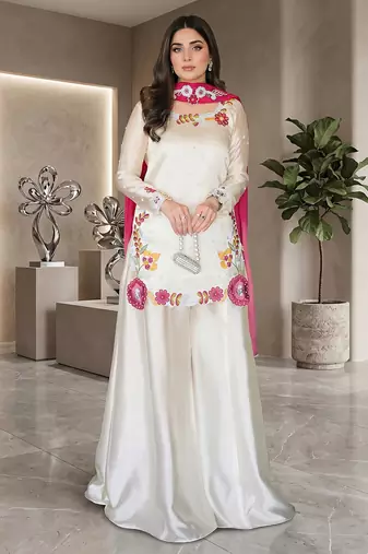 Elegant ivory silk sharara suit set with vibrant floral embroidery