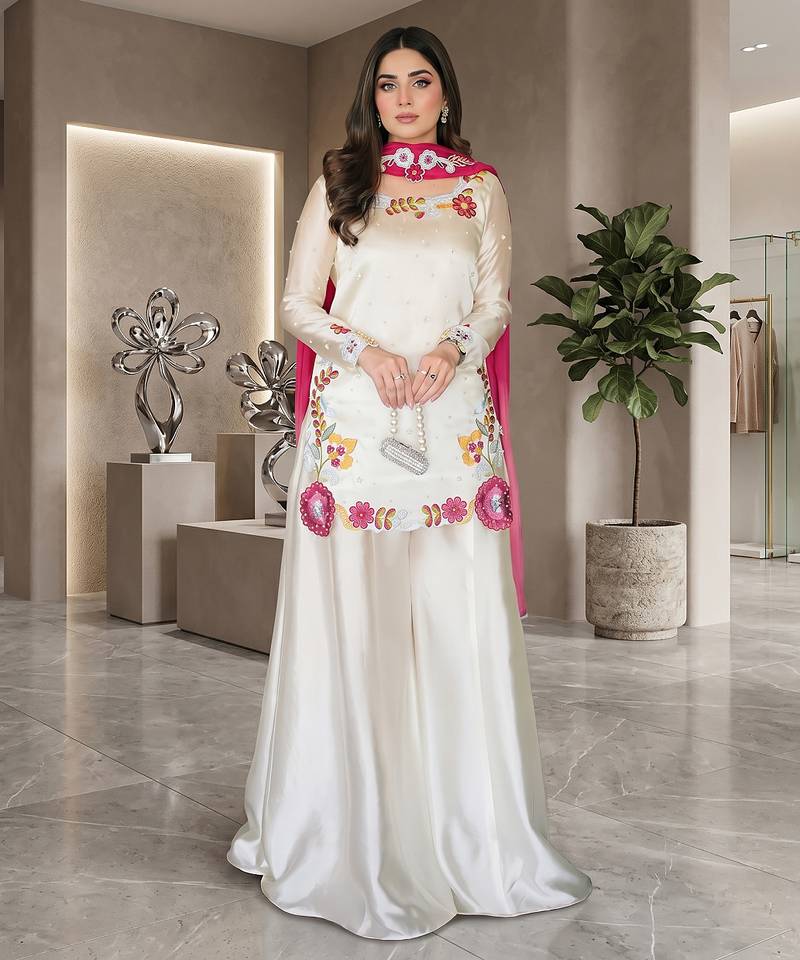 Elegant ivory silk sharara suit set with vibrant floral embroidery