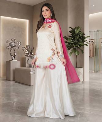 Elegant ivory silk sharara suit set with vibrant floral embroidery 2