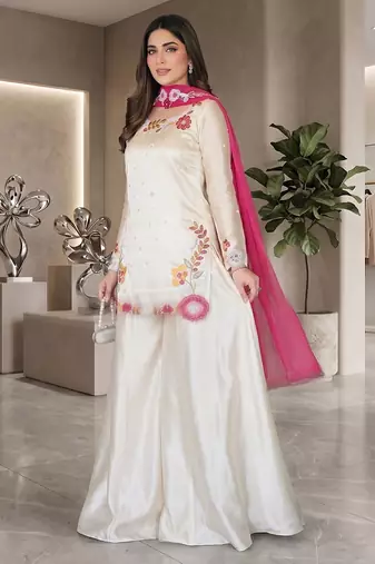 Elegant ivory silk sharara suit set with vibrant floral embroidery