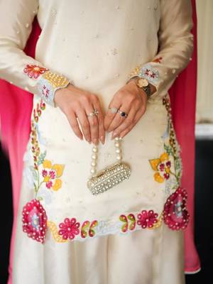 Elegant ivory silk sharara suit set with vibrant floral embroidery 3