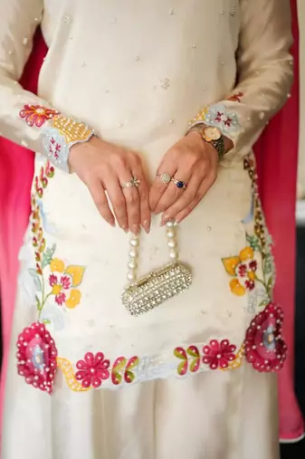 Elegant ivory silk sharara suit set with vibrant floral embroidery