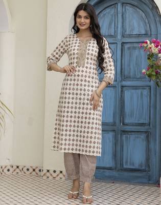 Women beige cotton neck has detailing all work over has block print border detailing kurta set 1
