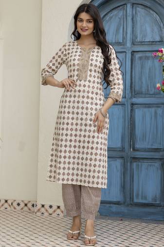 Women beige cotton neck has  detailing all work over has block print  border detailing  kurta set