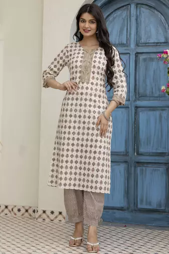 Women beige cotton neck has  detailing all work over has block print  border detailing  kurta set