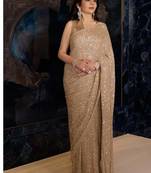 Gold color faux georgette rainbow sequin embroidered saree with silk blouse