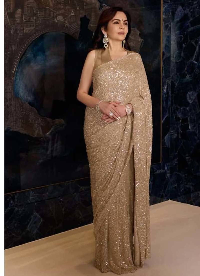 Gold color faux georgette rainbow sequin embroidered saree with silk blouse
