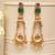 Gold plated green stones kundan earrings