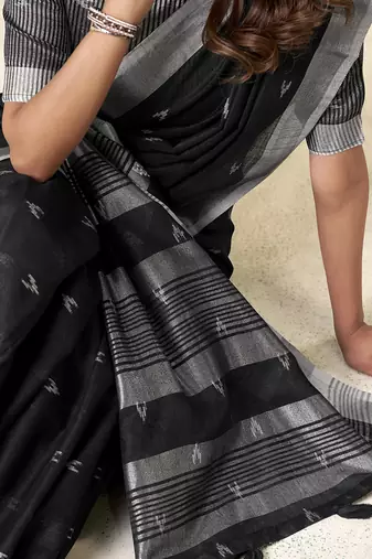 Black linen cotton saree with silver zari border & woven buti design