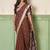 Brown linen cotton saree with silver zari border & woven buti design