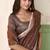 Brown linen cotton saree with silver zari border & woven buti design
