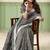 Grey linen cotton saree with silver zari border & woven buti design