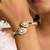Green stones gold plated kundan polki bracelet