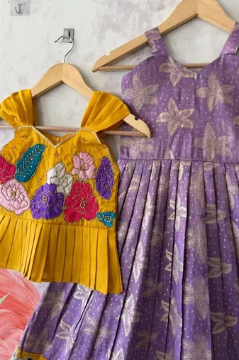 Festivewear lavender viscose tissue embroidered lace gown with maggam work koti