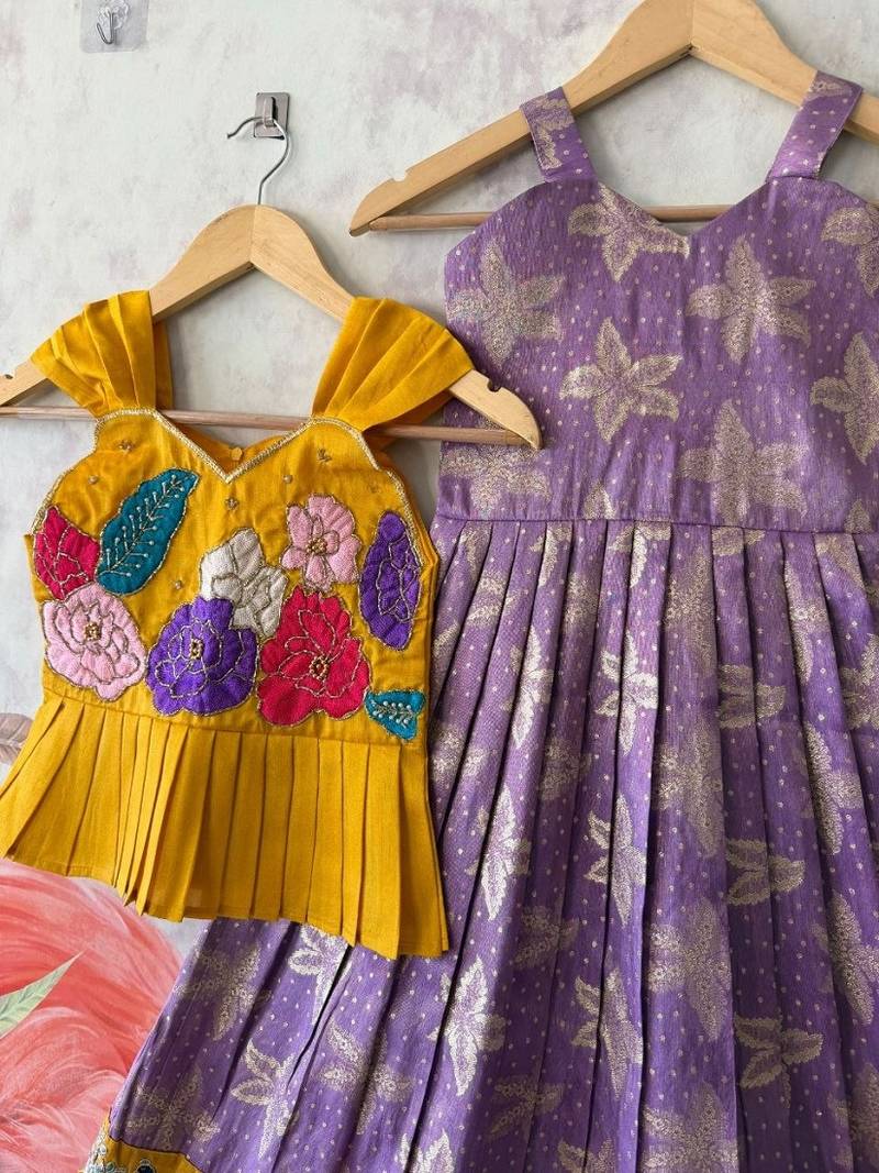 Festivewear lavender viscose tissue embroidered lace gown with maggam work koti