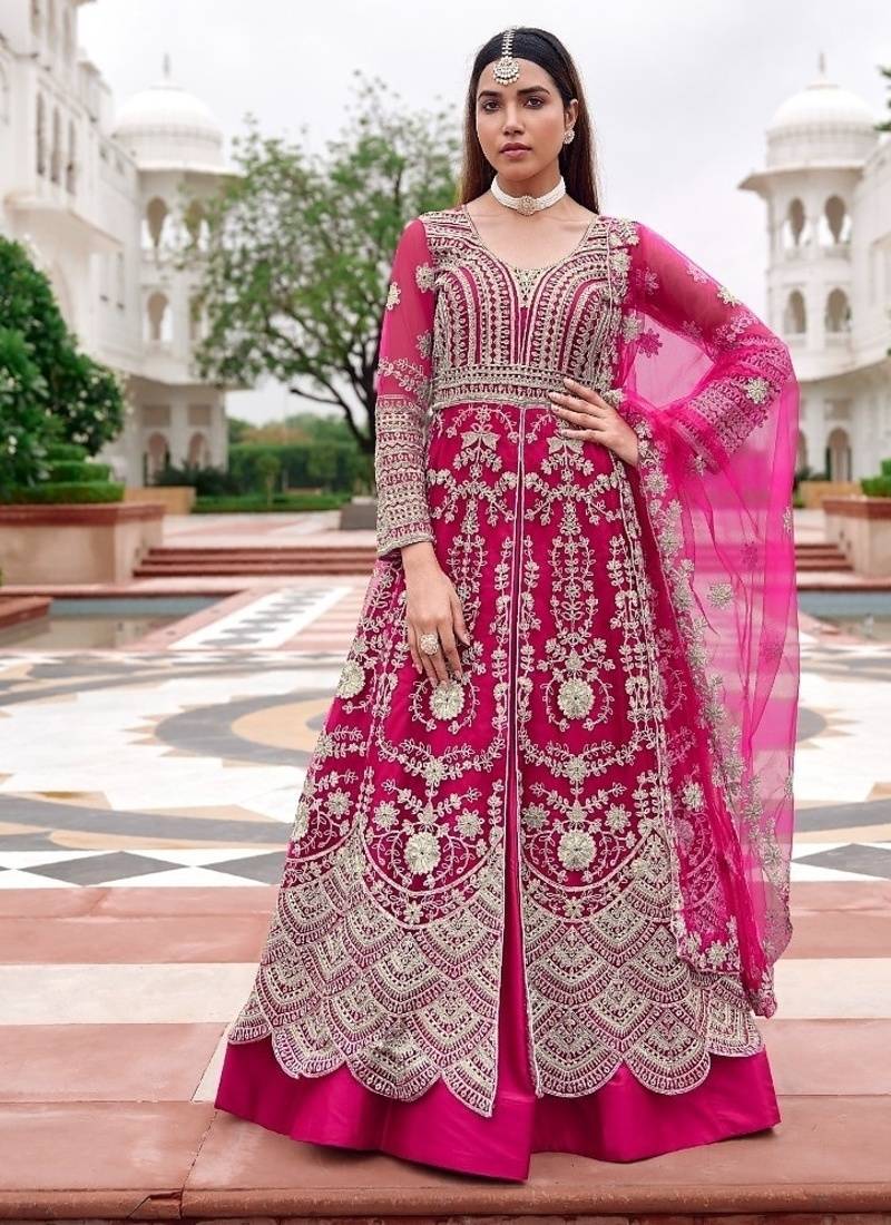 Rani pink butterfly net heavy embroidered semi-stitched suit set with dupatta