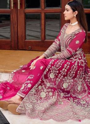 Rani pink butterfly net heavy embroidered semi-stitched suit set with dupatta 2