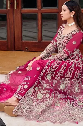 Rani pink butterfly net heavy embroidered semi-stitched suit set with dupatta