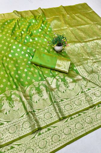 Green zari woven silk blend traditional saree with blouse piece
