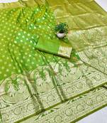 Green zari woven silk blend traditional saree with blouse piece