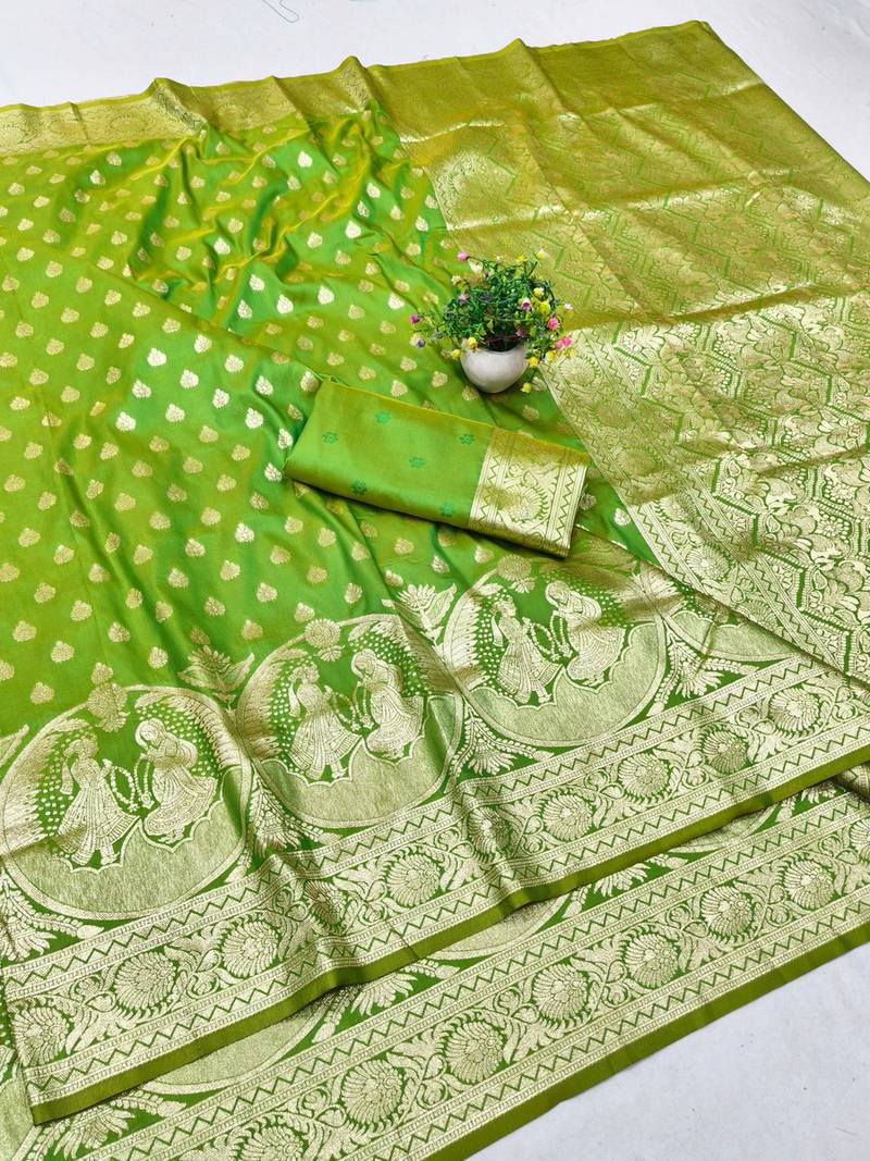 Green zari woven silk blend traditional saree with blouse piece