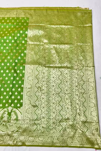 Green zari woven silk blend traditional saree with blouse piece