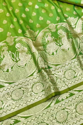 Green zari woven silk blend traditional saree with blouse piece