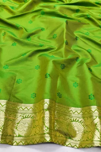Green zari woven silk blend traditional saree with blouse piece