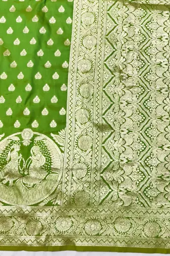 Green zari woven silk blend traditional saree with blouse piece