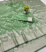 Light green zari woven banarasi silk blend traditional saree with blouse piece